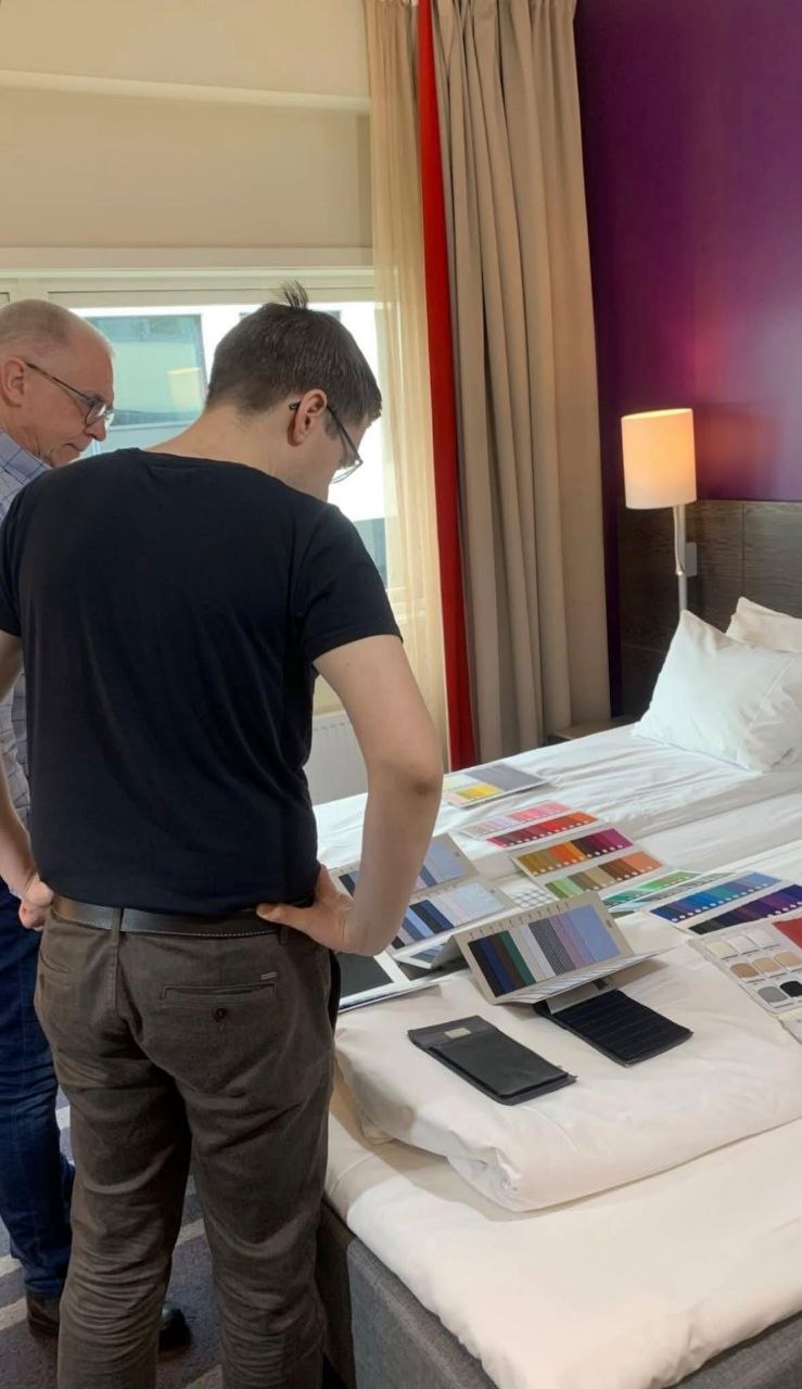 Real client photograph showing measurements and colour swatches during a fitting